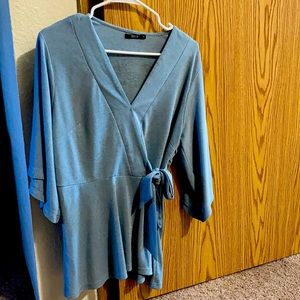 Glittery blouse and can be worn as a dress as well. Very calming spring color